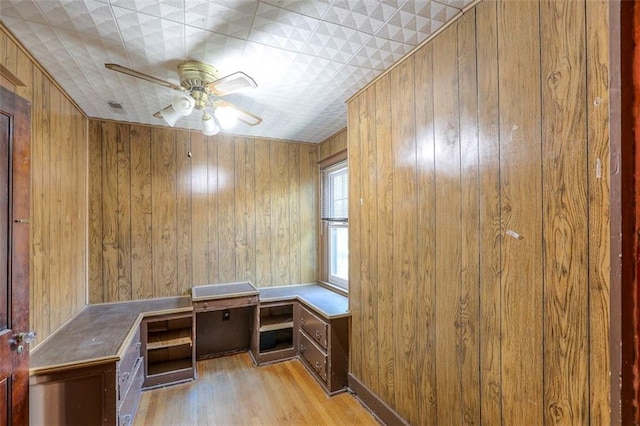 12 W 57th Ter, Kansas City, MO 64113 - unfurnished office featuring wood walls, light wood-style flooring, and ceiling fan