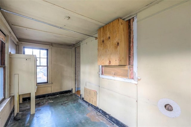 12 W 57th Ter, Kansas City, MO 64113 - empty room featuring unfinished concrete flooring