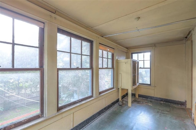 12 W 57th Ter, Kansas City, MO 64113 - unfurnished sunroom with concrete flooring