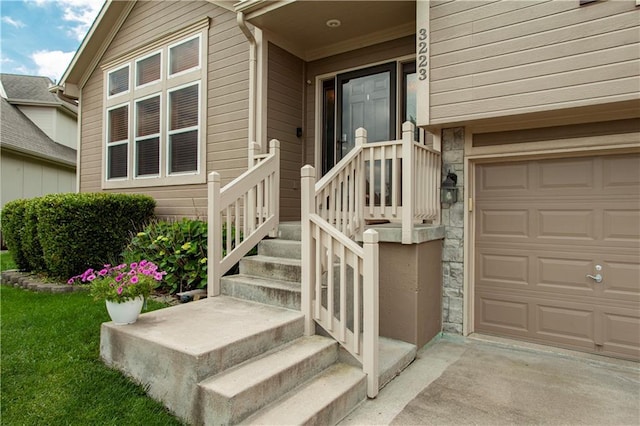 3223 SW Amber Ct, Lees Summit, MO 64082 - view of exterior entry with stone siding, a garage, and concrete driveway