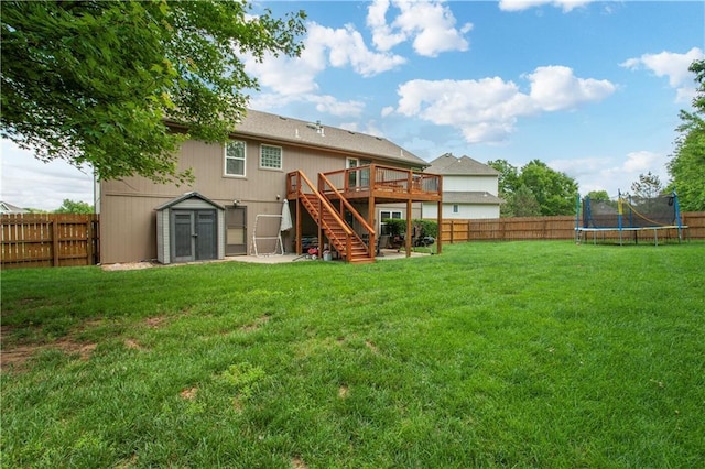 3223 SW Amber Ct, Lees Summit, MO 64082 - back of house featuring stairs, a deck, a trampoline, and a storage unit