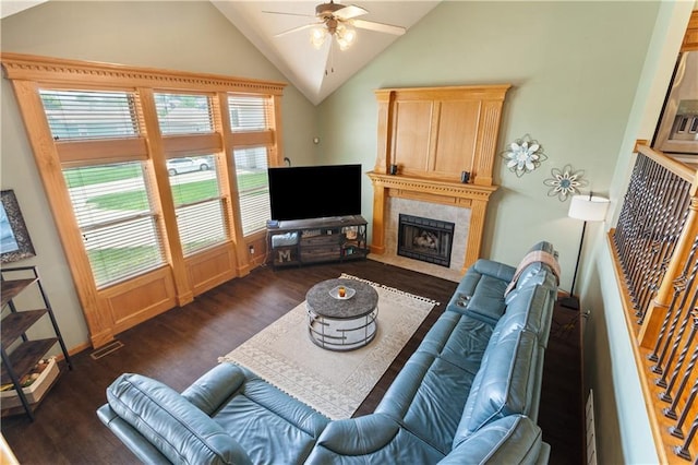 3223 SW Amber Ct, Lees Summit, MO 64082 - living area featuring dark wood-type flooring, ceiling fan, vaulted ceiling, a fireplace, and baseboards