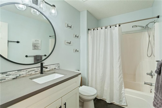 3223 SW Amber Ct, Lees Summit, MO 64082 - full bathroom featuring toilet, vanity, shower / bath combo, a textured ceiling, and tile patterned flooring
