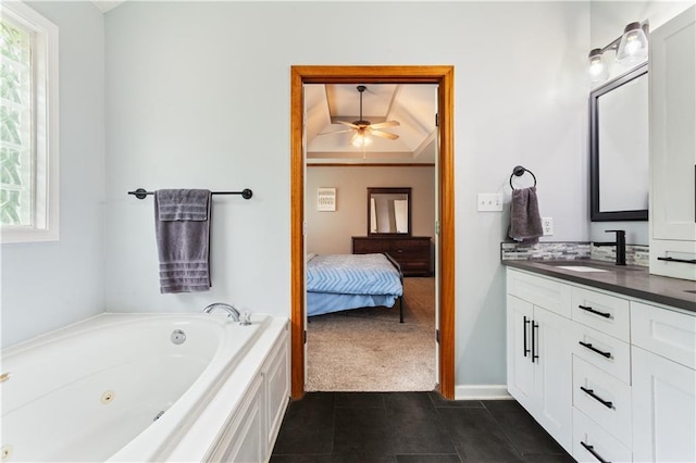 3223 SW Amber Ct, Lees Summit, MO 64082 - full bathroom featuring vanity, a whirlpool tub, tile patterned floors, ceiling fan, and ensuite bathroom