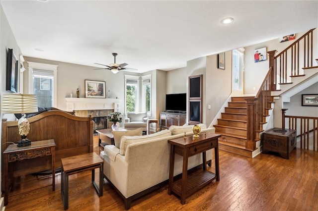 22404 S Roosevelt St, Spring Hill, KS 66083 - living area featuring a ceiling fan, wood-type flooring, healthy amount of natural light, a tiled fireplace, and recessed lighting