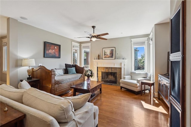 22404 S Roosevelt St, Spring Hill, KS 66083 - living area with wood finished floors, ceiling fan, and a fireplace