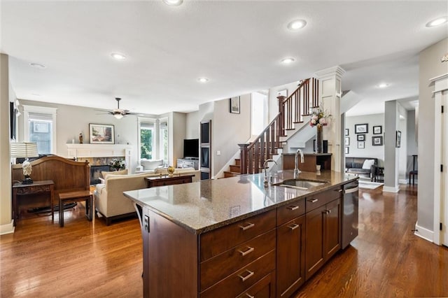 22404 S Roosevelt St, Spring Hill, KS 66083 - kitchen with a sink, dishwasher, ceiling fan, dark wood-style flooring, and a kitchen island with sink