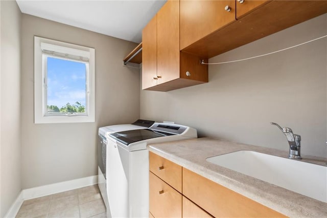 22404 S Roosevelt St, Spring Hill, KS 66083 - washroom with cabinet space, washer and dryer, baseboards, and light tile patterned floors