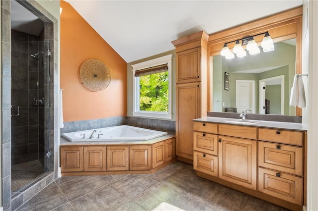 22404 S Roosevelt St, Spring Hill, KS 66083 - bathroom with lofted ceiling, a stall shower, a garden tub, vanity, and tile patterned flooring