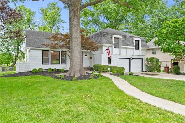 5000 W 96th St, Overland Park, KS 66207 - view of front facade featuring roof with shingles, a garage, concrete driveway, and a front lawn