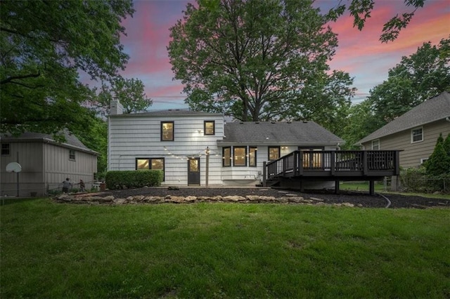 5000 W 96th St, Overland Park, KS 66207 - back of property featuring a deck, a chimney, and a lawn