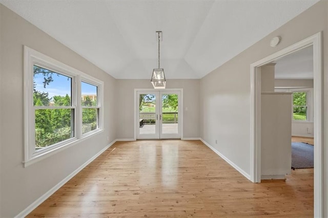 5000 W 96th St, Overland Park, KS 66207 - unfurnished dining area featuring light wood finished floors, baseboards, and vaulted ceiling