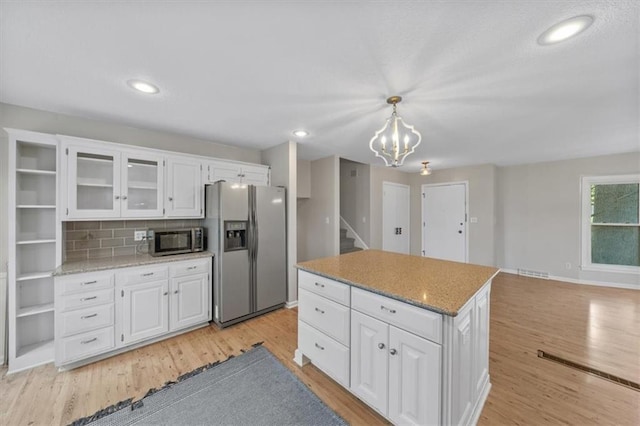 5000 W 96th St, Overland Park, KS 66207 - kitchen featuring appliances with stainless steel finishes, light wood-style floors, white cabinetry, and recessed lighting