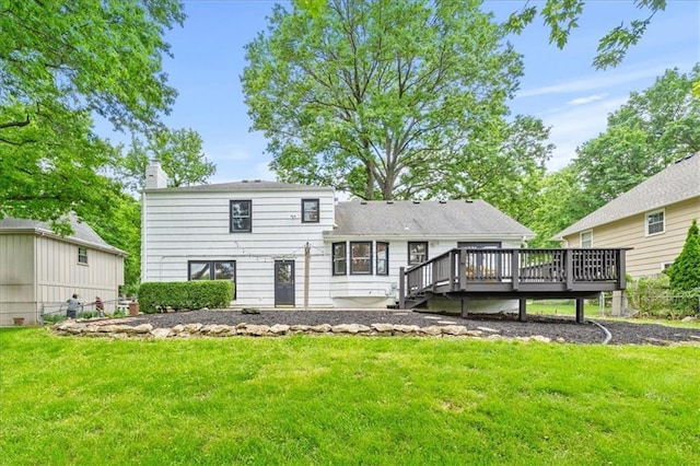 5000 W 96th St, Overland Park, KS 66207 - rear view of house featuring a deck, a chimney, and a lawn