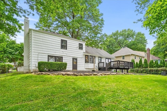 5000 W 96th St, Overland Park, KS 66207 - rear view of house with a deck and a chimney