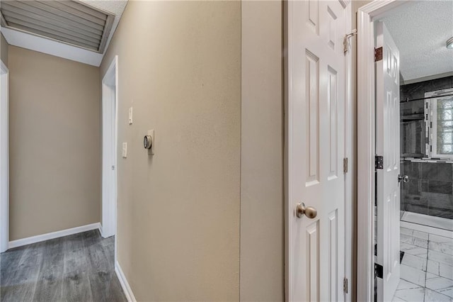 5912 E 98th St, Kansas City, MO 64134 - hall with baseboards and a textured ceiling