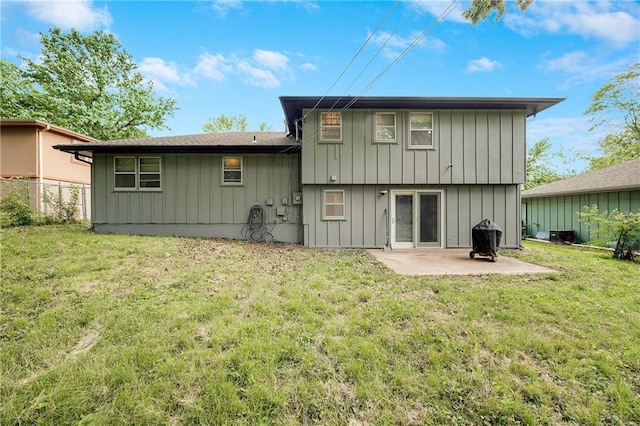 5912 E 98th St, Kansas City, MO 64134 - back of house featuring a patio area and board and batten siding