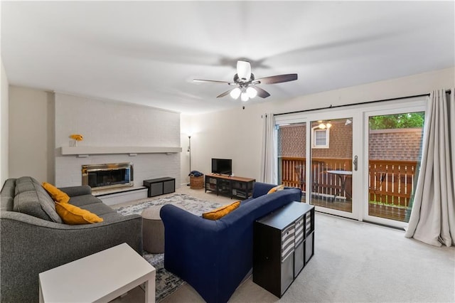 7616 W 59th Ter Unit 37, Overland Park, KS 66202 - living area featuring a fireplace, ceiling fan, and carpet
