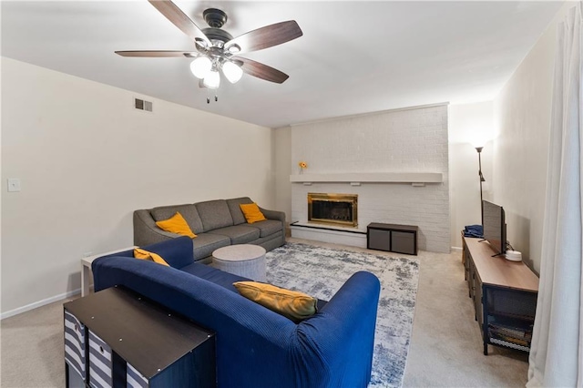 7616 W 59th Ter Unit 37, Overland Park, KS 66202 - living area featuring carpet, ceiling fan, and a brick fireplace