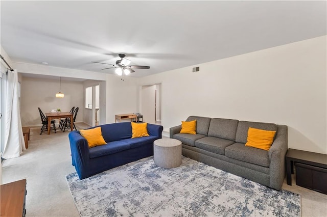 7616 W 59th Ter Unit 37, Overland Park, KS 66202 - living area featuring light carpet, a ceiling fan, and healthy amount of natural light
