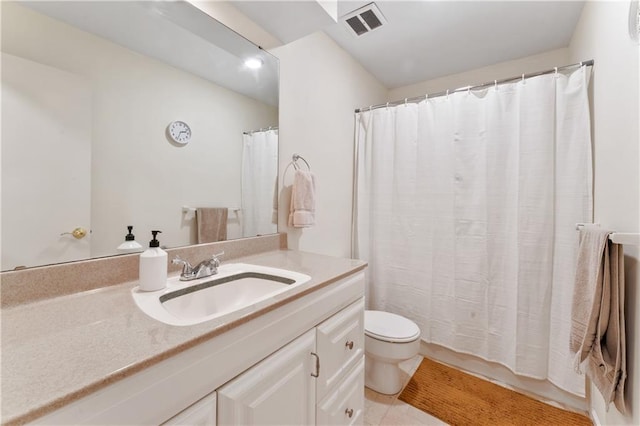 7616 W 59th Ter Unit 37, Overland Park, KS 66202 - bathroom featuring vanity, toilet, a shower with curtain, and tile patterned floors