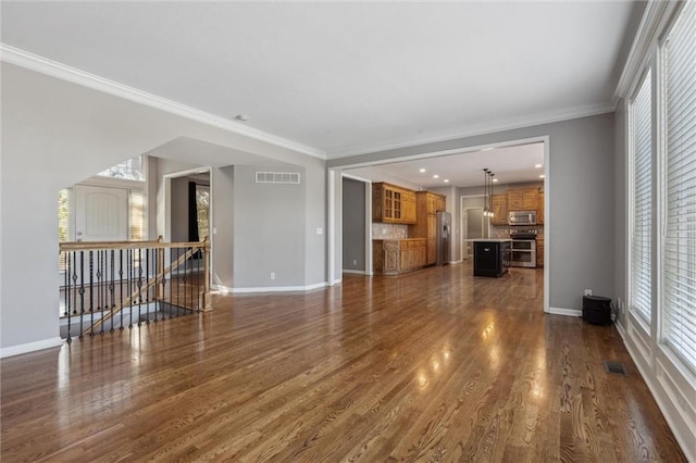 4528 N 108th St, Kansas City, KS 66109 - unfurnished living room featuring baseboards, dark wood-style flooring, and crown molding