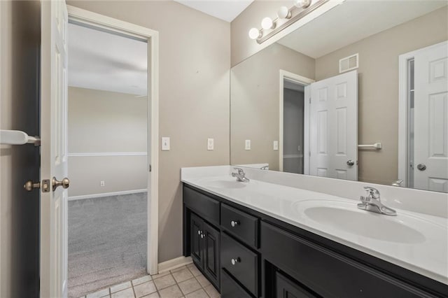 4528 N 108th St, Kansas City, KS 66109 - full bathroom featuring double vanity, tile patterned floors, and baseboards
