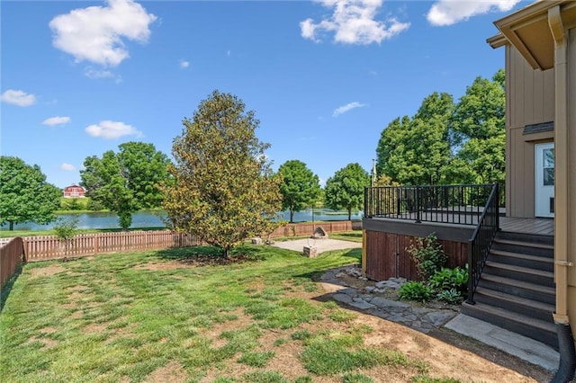 4528 N 108th St, Kansas City, KS 66109 - view of yard with a hot tub and a deck with water view