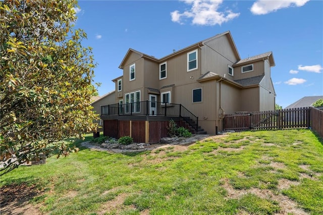 4528 N 108th St, Kansas City, KS 66109 - back of property featuring stairs and a wooden deck