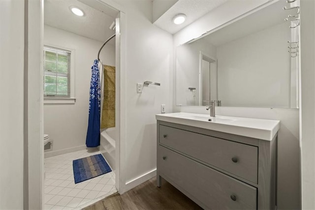 1038 N Woodland Ct, Oakwood, MO 64118 - full bathroom with vanity, toilet, shower / tub combo, and baseboards
