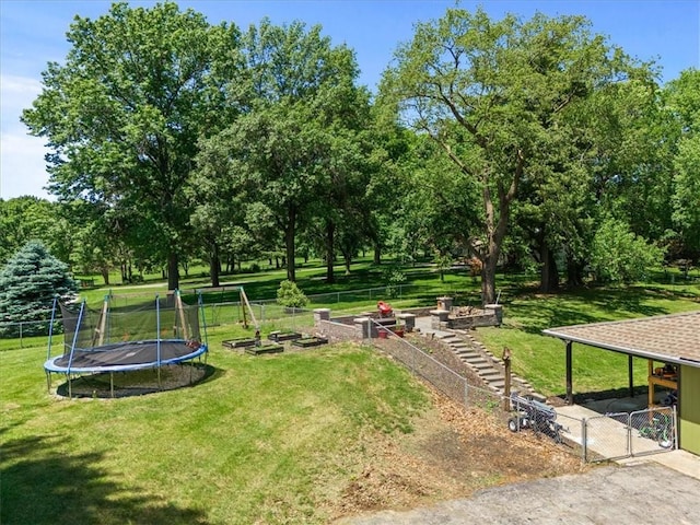 1038 N Woodland Ct, Oakwood, MO 64118 - view of community featuring a vegetable garden, a gate, and view of wooded area