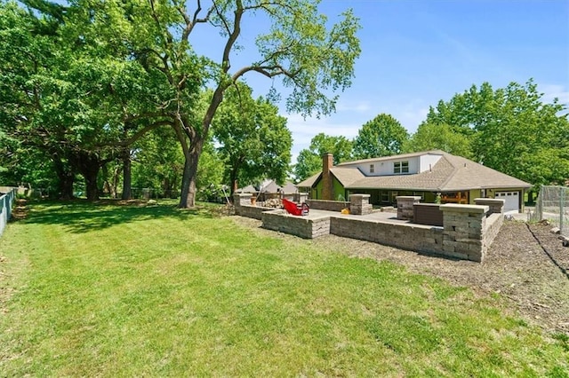 1038 N Woodland Ct, Oakwood, MO 64118 - view of yard with a patio and an attached garage