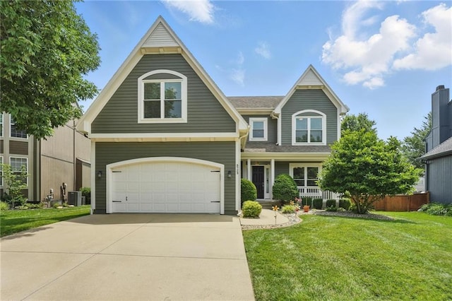 9729 Prairie Creek Rd, Lenexa, KS 66220 - view of front of property with concrete driveway and a garage