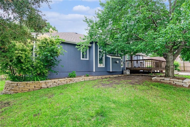 2721 SW Herefordshire Rd, Topeka, KS 66614 - view of green lawn with a wooden deck