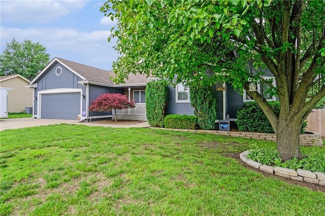 2721 SW Herefordshire Rd, Topeka, KS 66614 - view of property hidden behind natural elements featuring driveway, an attached garage, and cooling unit