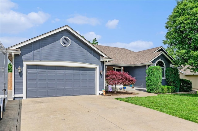 2721 SW Herefordshire Rd, Topeka, KS 66614 - ranch-style house with concrete driveway, a garage, and a front yard