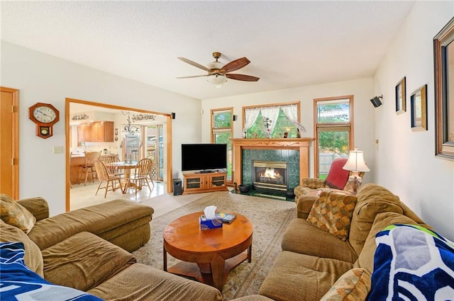 2721 SW Herefordshire Rd, Topeka, KS 66614 - living area featuring a ceiling fan, carpet floors, and a tile fireplace
