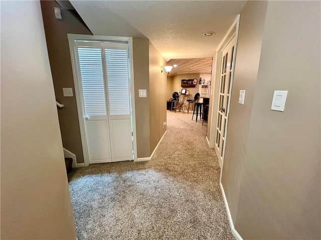 1402 NW Cedar Ct, Grain Valley, MO 64029 - hallway with carpet floors, baseboards, and stairway