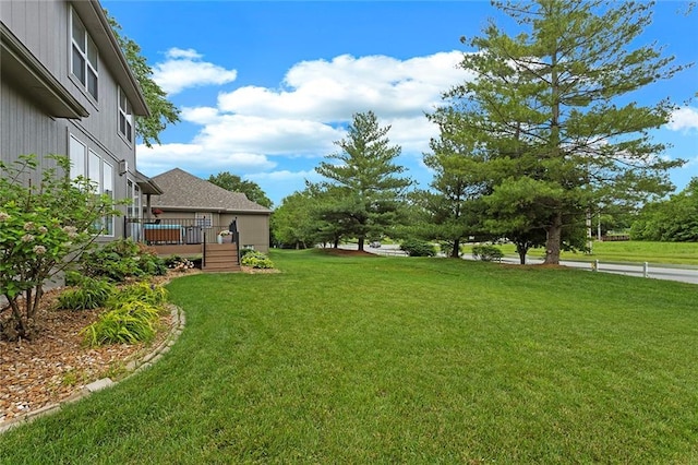 1402 NW Cedar Ct, Grain Valley, MO 64029 - view of grassy yard featuring a wooden deck