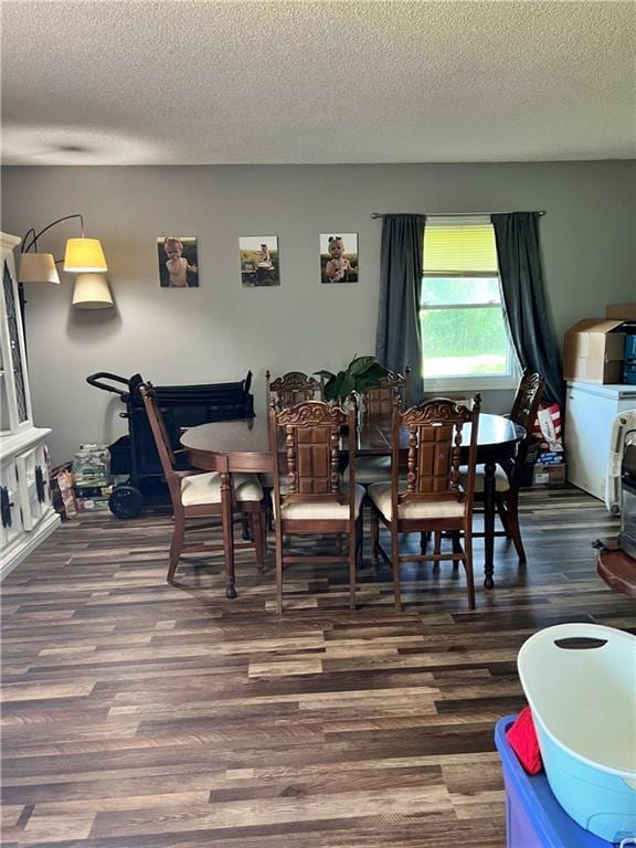 400 S 7th St, Arma, KS 66712 - dining space with wood finished floors and a textured ceiling