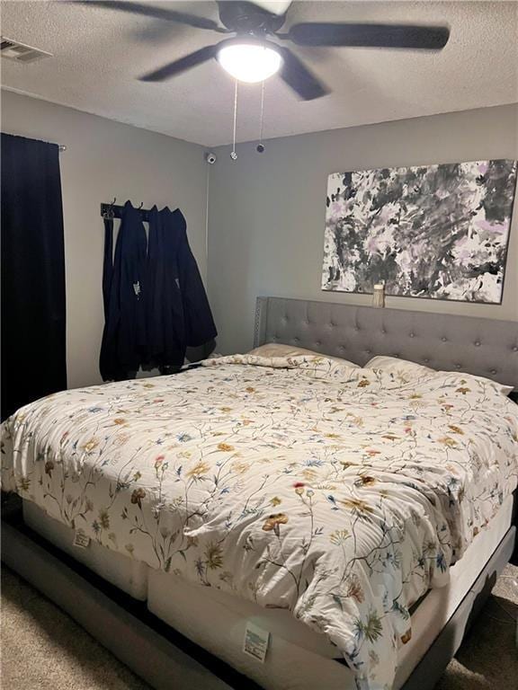 400 S 7th St, Arma, KS 66712 - carpeted bedroom featuring ceiling fan and a textured ceiling