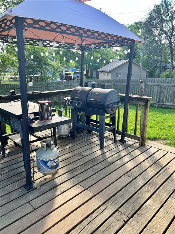 400 S 7th St, Arma, KS 66712 - wooden deck with a grill and a gazebo