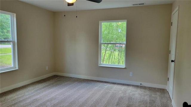 208 W Marshall St, Mayview, MO 64071 - carpeted spare room with ceiling fan, healthy amount of natural light, and baseboards