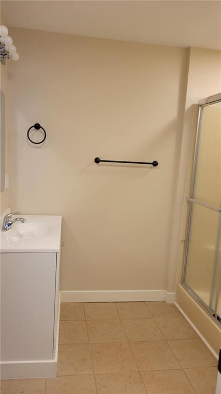 208 W Marshall St, Mayview, MO 64071 - bathroom with vanity, baseboards, and tile patterned floors