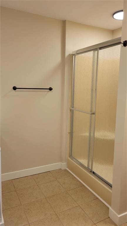208 W Marshall St, Mayview, MO 64071 - full bathroom featuring baseboards, tile patterned flooring, and a shower with shower door