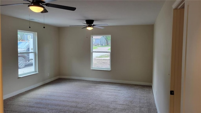 208 W Marshall St, Mayview, MO 64071 - unfurnished room with plenty of natural light, a ceiling fan, carpet floors, and baseboards