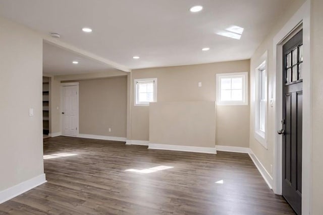 4204 E 60th Ter, Kansas City, MO 64130 - unfurnished room featuring baseboards, dark wood-style flooring, a smoke detector, and recessed lighting