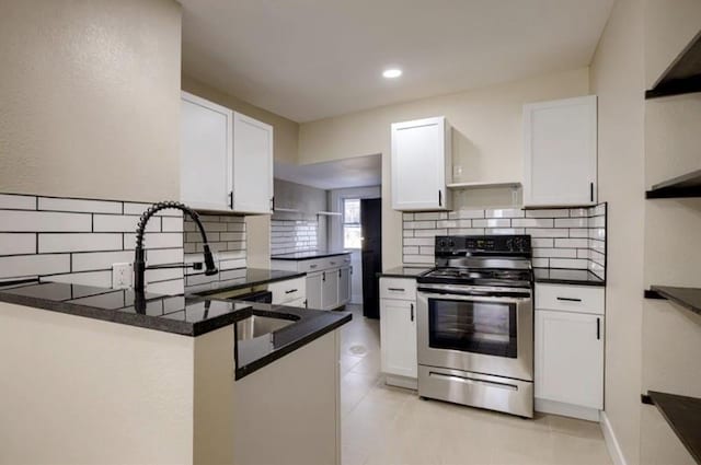 4204 E 60th Ter, Kansas City, MO 64130 - kitchen with stainless steel range with electric cooktop, white cabinetry, and recessed lighting