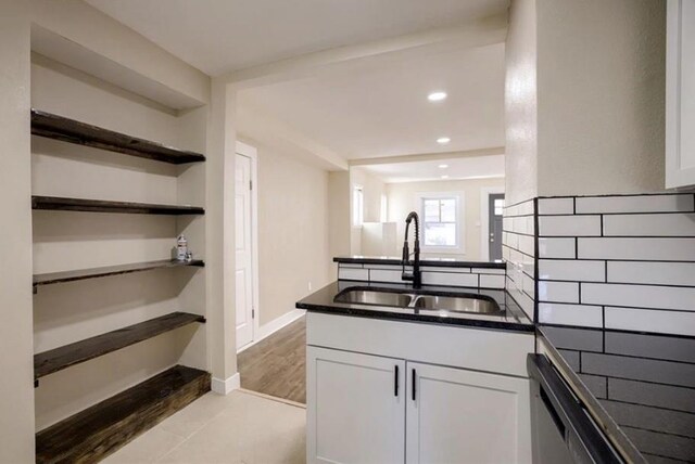 4204 E 60th Ter, Kansas City, MO 64130 - kitchen featuring a sink, dark countertops, white cabinets, open shelves, and recessed lighting