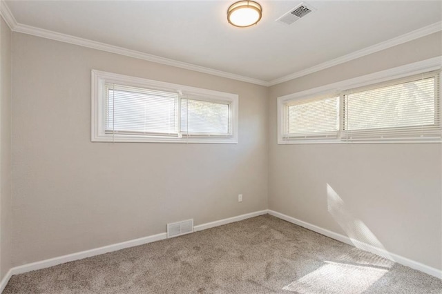 7119 E 111th Ter, Kansas City, MO 64134 - empty room featuring carpet flooring, crown molding, and baseboards